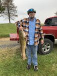 Daniel Crouse of Martinsburg, W.Va. shows off a big flathead catfish caught on a cold, rainy morning. 
