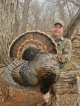 Sean Young of Charleston, W.Va. with a Rio Grande turkey killed on a hunt in Oklahoma in the spring of 2022
