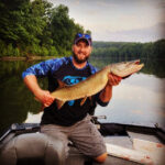 Joseph Pedersen of Martinsburg, W.Va. with a musky caught while fishing the Potomac River near Hedgesville, W.Va.  Caught on a Musky Innovations Swimmin’ Dawg.
